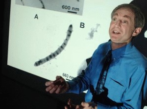 Professor Sadler with diagram of iron banded fibril